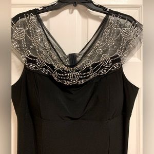 Brand new, R & M Richard’s black gown, size 18, misses. Never Worn